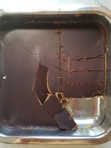 chocolate peanut butter homemade twix bars in pan