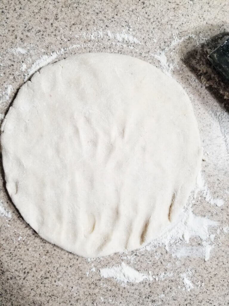 rolling out the Gluten Free Pie Crust on the counter