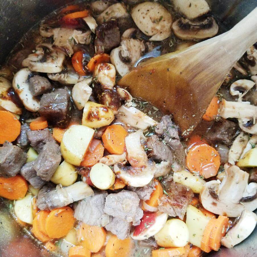 aged beef and vegetable stew ingredients in the instant pot before cooking 