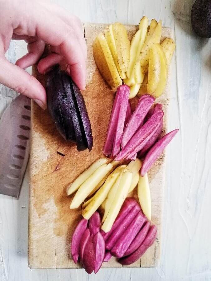 rainbow potatoes on a cutting board