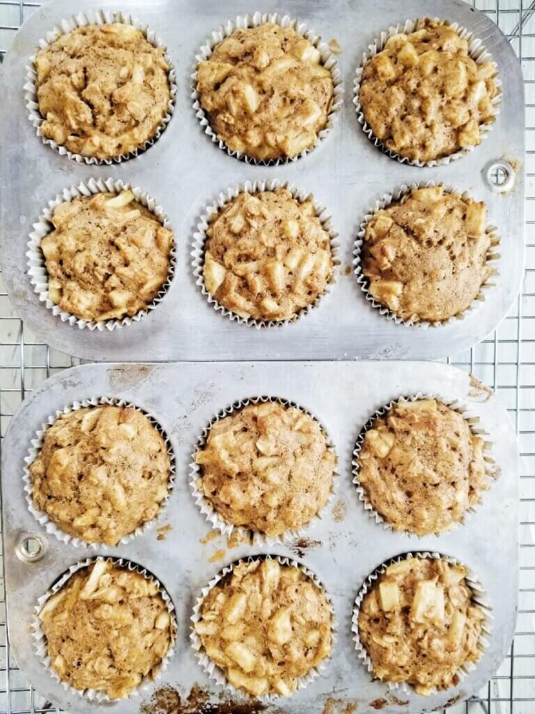 apple cinnamon oatmeal muffins on a wire cooling rack