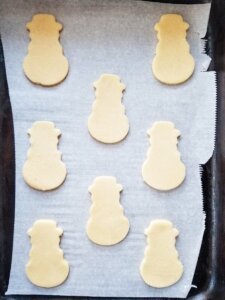 coconut flour christmas cookie cutouts on a cookie sheet