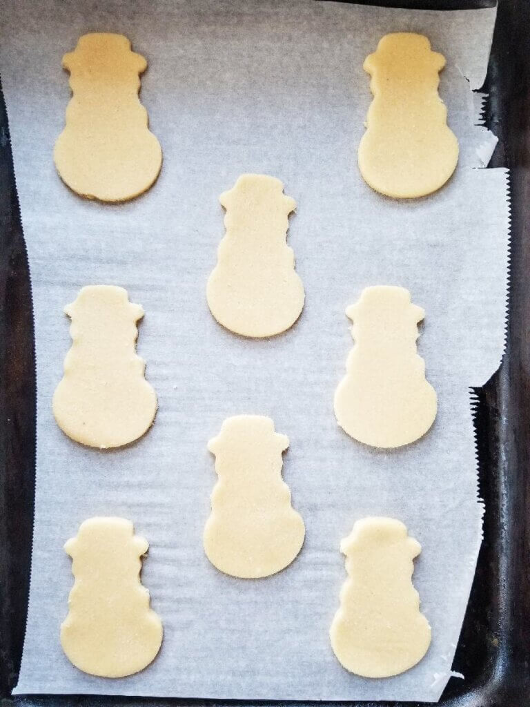 coconut flour christmas cookie cutouts on a cookie sheet