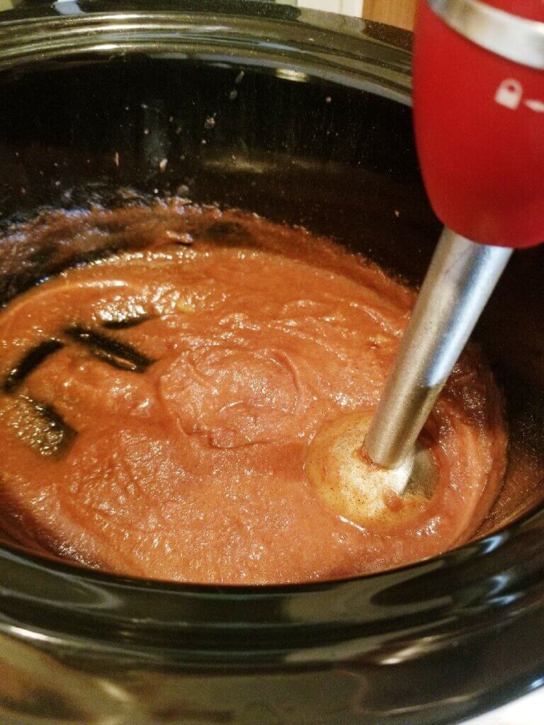 using an immersion blender to puree sugar free crockpot apple butter