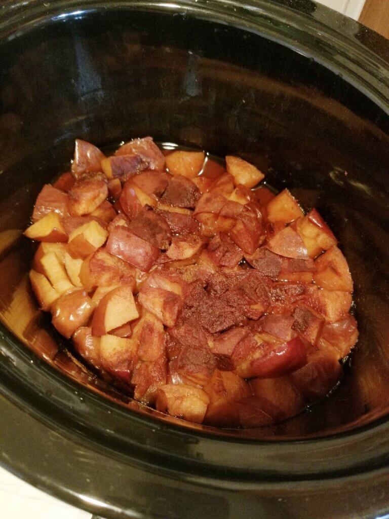 apples and spices cooked in a crockpot