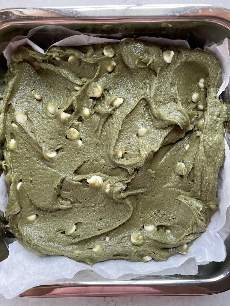 green brownie batter with white chocolate chips