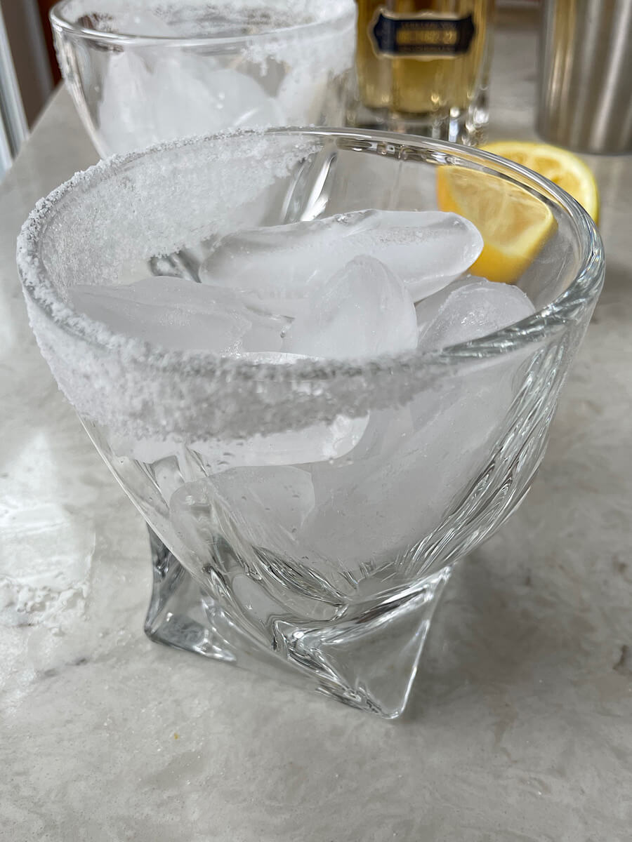 glass with a sugared rim filled with ice cubes
