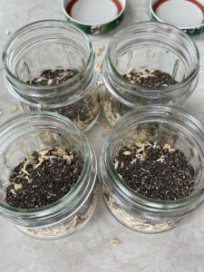 oats and chia seeds in glass jars