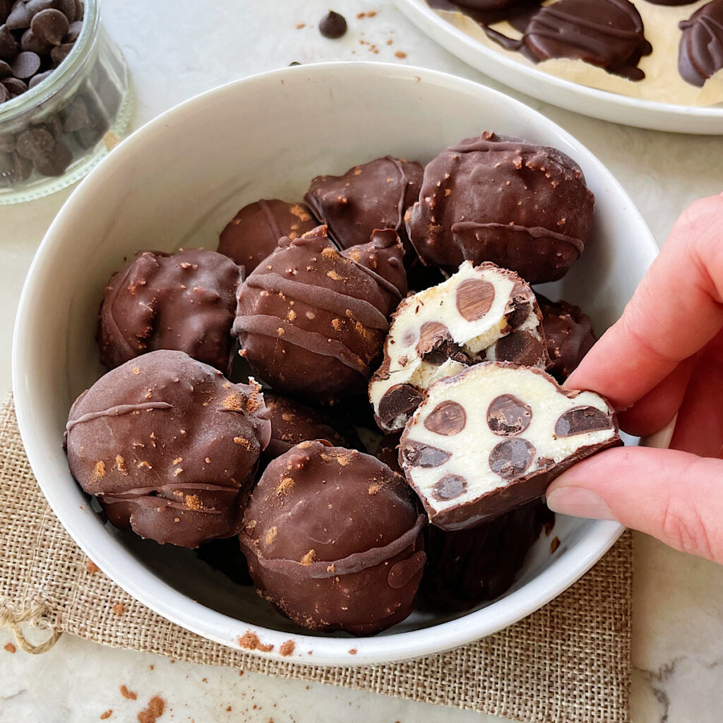 healthy cannoli balls dipped in dark chocolate coating