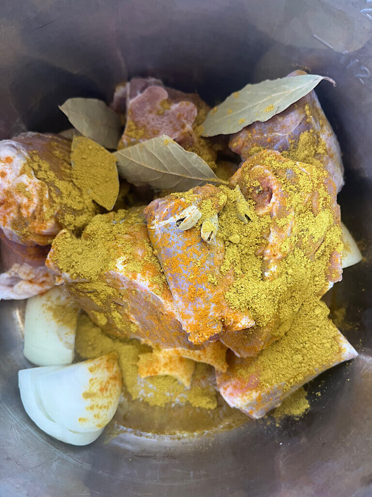 lamb sprinkled with mansaf spice in a pressure cooker